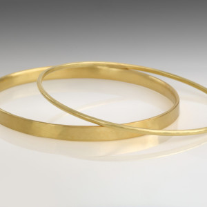 Two 18 carat gold bangles