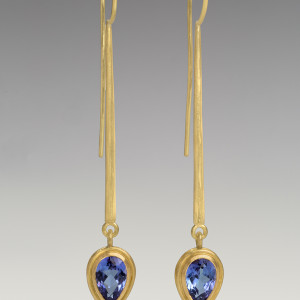 18 carat long tapered eardrops with facetted tanzanites