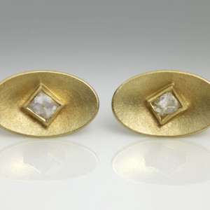 18 carat green gold oval earstuds with uncut octahedral diamond