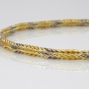 Detail of loop-in-loop chain in 18 carat yellow, red, green and white gold Detail of loop-in-loop chain in 18 carat yellow, red, green and white gold