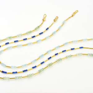 Three 18 carat gold necklaces with gemstone beads - green beryl, blue sapphire and pale blue aquamarine