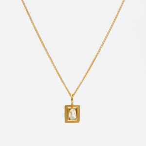 18 carat gold oblong pendant with an uncut ‘raw’ diamond 18 carat gold oblong pendant with an uncut ‘raw’ diamond