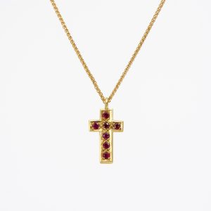 18 carat gold cross, pavé-set with facetted rubies 18 carat gold cross, pavé-set with facetted rubies