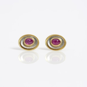 18 carat gold oval earstuds in yellow and white gold with cabochon rubies