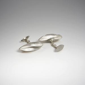 Silver twisted cufflinks with chain fitting Silver twisted cufflinks with chain fitting
