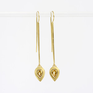18 carat gold long tapered drops with teardrop facetted yellow sapphires set in white gold